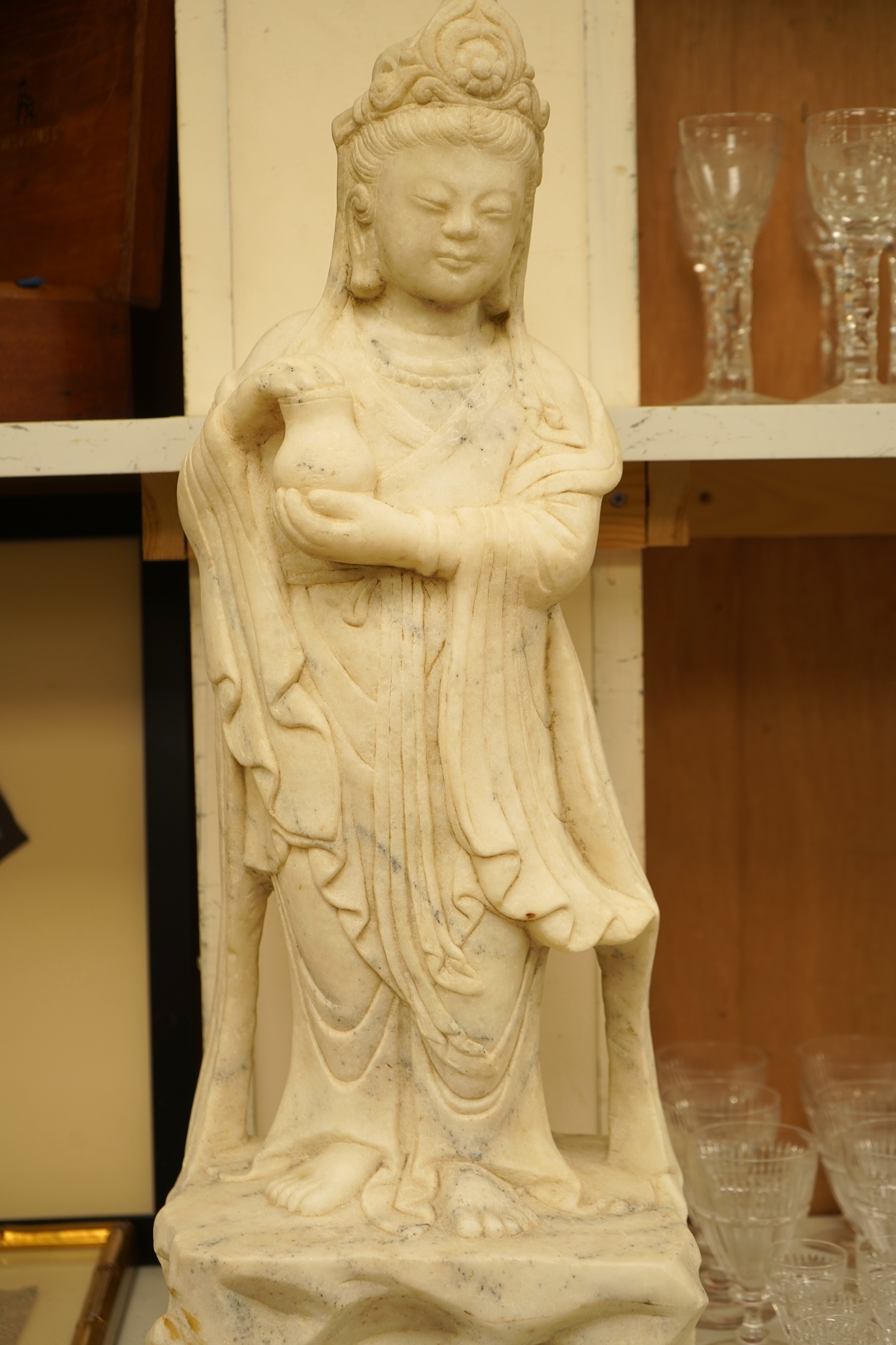 A large Chinese alabaster carving of Guanyin, 66cm high